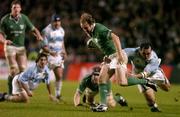 27 November 2004; Denis Hickie, Ireland, is tackled by Rodrigo Roncero, Argentina. Rugby International, Ireland v Argentina, Lansdowne Road, Dublin. Picture credit; Brendan Moran / SPORTSFILE