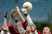 3 December 2004; Eoin Wearen, second from right, and Sean Rogers, Scoil Fhiachra, Beaumont, in action against Eoin Crowley, right, and Ryan Basquel, Scoil Cholmcille, Knocklyon. Allianz Cumann na mBunscol Football Final, Corn Kitterick, Scoil Cholmcille, Knocklyon v Scoil Fhiachra, Beaumont, Croke Park, Dublin. Picture credit; David Maher / SPORTSFILE