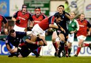 3 December 2004; Rob Henderson, Munster, is tackled by Xavier Sadourny, Castres Olympique. Heineken European Cup 2004-2005, Pool 4, Round 3, Castres Olympique v Munster, Stade Pierre Antoine, Castres, France. Picture credit; Matt Browne / SPORTSFILE