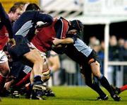 3 December 2004; Paul O'Connell, Munster, is tackled by Rodrigo Capo Ortega (left) and Xavier Sadourny, Castres Olympique. Heineken European Cup 2004-2005, Pool 4, Round 3, Castres Olympique v Munster, Stade Pierre Antoine, Castres, France. Picture credit; Matt Browne / SPORTSFILE