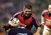3 December 2004; Marcus Horan, Munster, is tackled by Alexandre Albouy, Castres Olympique. Heineken European Cup 2004-2005, Pool 4, Round 3, Castres Olympique v Munster, Stade Pierre Antoine, Castres, France. Picture credit; Matt Browne / SPORTSFILE