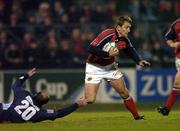 3 December 2004; Shaun Payne, Munster, goes past the tackle of Richard Dourthe, Castres Olympique. Heineken European Cup 2004-2005, Pool 4, Round 3, Castres Olympique v Munster, Stade Pierre Antoine, Castres, France. Picture credit; Matt Browne / SPORTSFILE