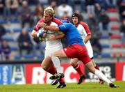 4 December 2004; Roger Wilson, Ulster, is tackled by Raphael Jechoux, Stade Francais. Heineken European Cup 2004-2005, Pool 6, Round 3, Stade Francais v Ulster, Stade Jean Bouin, Paris, France. Picture credit; Brian Lawless / SPORTSFILE