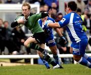 4 December 2004; Paul Warwick, Connacht, holds off the challenge of Julien Brugnaut, Montpellier, on the way to scoring a try. European Challenge Cup 2004-2005, Connacht v Montpellier, Sportsground, Galway. Picture credit; Damien Eagers / SPORTSFILE