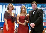 4 December 2004; Aoife Murray of Cork is presented with her All-Star award by Minister for Finance, Brian Cowen TD, and Miriam O'Callaghan, President of Cumann Camogaiochta na nGael, at the 2004 Camogie All-Star Awards. Citywest Hotel, Dublin. Picture credit; Brendan Moran / SPORTSFILE