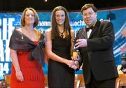 4 December 2004; Suzanne Kelly of Tipperary is presented with her All-Star award by Minister for Finance, Brian Cowen TD, and Miriam O'Callaghan, President of Cumann Camogaiochta na nGael, at the 2004 Camogie All-Star Awards. Citywest Hotel, Dublin. Picture credit; Brendan Moran / SPORTSFILE