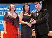 4 December 2004; Ciara Gaynor of Tipperary is presented with her All-Star award by Minister for Finance, Brian Cowen TD, and Miriam O'Callaghan, President of Cumann Camogaiochta na nGael, at the 2004 Camogie All-Star Awards. Citywest Hotel, Dublin. Picture credit; Brendan Moran / SPORTSFILE