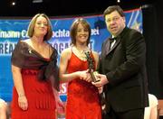 4 December 2004; Kate Kelly of Wexford is presented with her All-Star award by Minister for Finance, Brian Cowen TD, and Miriam O'Callaghan, President of Cumann Camogaiochta na nGael, at the 2004 Camogie All-Star Awards. Citywest Hotel, Dublin. Picture credit; Brendan Moran / SPORTSFILE