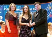 4 December 2004; Jennifer O'Leary of Cork is presented with her All-Star award by Minister for Finance, Brian Cowen TD, and Miriam O'Callaghan, President of Cumann Camogaiochta na nGael, at the 2004 Camogie All-Star Awards. Citywest Hotel, Dublin. Picture credit; Brendan Moran / SPORTSFILE