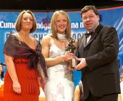 4 December 2004; Mairin McAleenan of Down is presented with her All-Star award by Minister for Finance, Brian Cowen TD, and Miriam O'Callaghan, President of Cumann Camogaiochta na nGael, at the 2004 Camogie All-Star Awards. Citywest Hotel, Dublin. Picture credit; Brendan Moran / SPORTSFILE