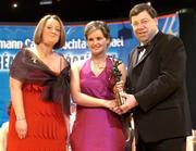 4 December 2004; Sinead Millea of Kilkenny is presented with her All-Star award by Minister for Finance, Brian Cowen TD, and Miriam O'Callaghan, President of Cumann Camogaiochta na nGael, at the 2004 Camogie All-Star Awards. Citywest Hotel, Dublin. Picture credit; Brendan Moran / SPORTSFILE