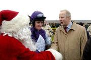 5 December 2004; Tom Taaffe, trainer and Barry Geraghty, jockey, are congratulated by Santa Clause after his horse Kicking King won the John Durkan Memorial Punchestown Steeplechase. Punchestown Racecourse, Co. Kildare. Picture credit; Matt Browne / SPORTSFILE
