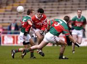 5 December 2004; Shane Lannon, Stradbally, in action against Declan Callinan (5) and Brendan Moloney, Kilmurray-Ibrickane. AIB Munster Club Senior Football Final, Kilmurry-Ibrickane v Stradbally, Semple Stadium, Thurles, Co. Tipperary. Picture credit; Damien Eagers / SPORTSFILE