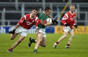 5 December 2004; Odran O'Dwyer, Kilmurry-Ibrickane, in action against John Coffey, left and Stephen Lawlor, Stradbally. AIB Munster Club Senior Football Final, Kilmurry-Ibrickane v Stradbally, Semple Stadium, Thurles, Co. Tipperary. Picture credit; Damien Eagers / SPORTSFILE