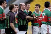 5 December 2004; Referee Michael Collins is confronted by Kilurray-Ibrickane players after the final whistle. AIB Munster Club Senior Football Final, Kilmurry-Ibrickane v Stradbally, Semple Stadium, Thurles, Co. Tipperary. Picture credit; Damien Eagers / SPORTSFILE