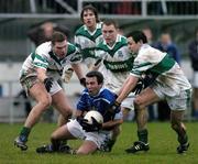 5 December 2004; Nicky Hamill, Skyrne, is tackled by Portlaoise players , l to r,  Enda Coleman, Colm Parkinson, Brian McCormack and Brian Mulligan. AIB Leinster Club Senior Football Final, Portlaoise v Skyrne, St. Conleth's Park, Newbridge, Co. Kildare. Picture credit; Ray McManus / SPORTSFILE