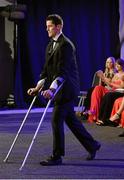 8 November 2013; Dublin's Rory O'Carroll walks up to collect his 2013 GAA GPA All-Star award on crutches. GAA GPA All-Star Awards 2013 Sponsored by Opel, Croke Park, Dublin. Picture credit: Brendan Moran / SPORTSFILE