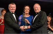 9 November 2013; Geraldine O'Flynn, Cork, is presented with her TG4 Senior Players' Player of the Year award by Pat Quill, President of the Ladies Gaelic Football Association, in the company of Pól O Gallchóir, left, Ceannsaí, TG4. TG4 Ladies Football All-Star Awards 2013, Citywest Hotel, Saggart, Co. Dublin. Picture credit: Brendan Moran / SPORTSFILE