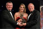9 November 2013; Briege Corkery, Cork, is presented with her TG4 Ladies Football All-Star Award by Pat Quill, President of the Ladies Gaelic Football Association, in the company of Pól O Gallchóir, left, Ceannsaí, TG4. TG4 Ladies Football All-Star Awards 2013, Citywest Hotel, Saggart, Co. Dublin. Picture credit: Brendan Moran / SPORTSFILE