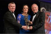 9 November 2013; Geraldine O'Flynn, Cork, is presented with her TG4 Ladies Football All-Star Award by Pat Quill, President of the Ladies Gaelic Football Association, in the company of Pól O Gallchóir, left, Ceannsaí, TG4. TG4 Ladies Football All-Star Awards 2013, Citywest Hotel, Saggart, Co. Dublin. Picture credit: Brendan Moran / SPORTSFILE