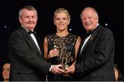 9 November 2013; Valerie Mulcahy, Cork, is presented with her TG4 Ladies Football All-Star Award by Pat Quill, President of the Ladies Gaelic Football Association, in the company of Pól O Gallchóir, left, Ceannsaí, TG4. TG4 Ladies Football All-Star Awards 2013, Citywest Hotel, Saggart, Co. Dublin. Picture credit: Brendan Moran / SPORTSFILE