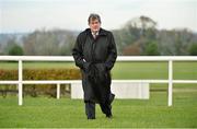10 November 2013; Horse owner JP McManus makes his way acrross the course after arriving ahead of the Boylesports.com Quick Bet Racing 'For Auction' Novice Hurdle. Navan Racecourse, Navan, Co. Meath. Picture credit: Barry Cregg / SPORTSFILE