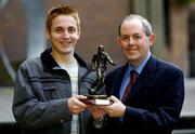 7 December 2004; Kevin Doyle of Cork City, left, who was presented with the eircom Soccer Writers Association of Ireland Player of the Month award for November by Padraig Corkery, Head of Sponsorship, eircom. Jacob's Ladder, Nassau Street, Dublin. Picture credit; Brendan Moran / SPORTSFILE