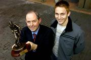 7 December 2004; Kevin Doyle of Cork City who was presented with the eircom Soccer Writers Association of Ireland Player of the Month award for November by Padraig Corkery, left, Head of Sponsorship, eircom. Jacob's Ladder, Nassau Street, Dublin. Picture credit; Brendan Moran / SPORTSFILE