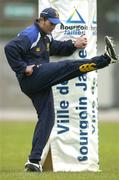 9 December 2004; Leinster out-half David Holwell does some warm up exercises during kicking practice at the match venue. Stade Peirre Rajon, Bourgoin - Jailleau, France. Picture credit; Brendan Moran / SPORTSFILE