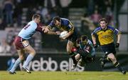 10 December 2004; Girvan Dempsey, Leinster, supported by team-mate Brian O'Driscoll, is tackled by Anthony Forest, left, and Jean Francois Coux, Bourgoin. Heineken European Cup 2004-2005, Pool 2, Round 4, Bourgoin v Leinster, Bourgoin-Jailleau, France. Picture credit; Brendan Moran / SPORTSFILE