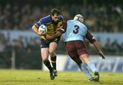 10 December 2004; Felipe Contepomi, Leinster, is tackled by Pascal Peyron, Bourgoin. Heineken European Cup 2004-2005, Pool 2, Round 4, Bourgoin v Leinster, Bourgoin-Jailleau, France. Picture credit; Brendan Moran / SPORTSFILE