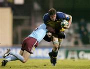 10 December 2004; Malcolm O'Kelly, Leinster, is tackled by Glenn Davis, Bourgoin. Heineken European Cup 2004-2005, Pool 2, Round 4, Bourgoin v Leinster, Bourgoin-Jailleau, France. Picture credit; Brendan Moran / SPORTSFILE