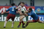 11 December 2004; Jonny Bell, Ulster, is tackled by Olivier Brouzet, 4, and Mathieu Blin, Stade Francais. Heineken European Cup 2004-2005, Pool 6, Round 4, Ulster v Stade Francais, Ravenhill, Belfast. Picture credit; Matt Browne / SPORTSFILE