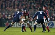 11 December 2004; Alan Quinlan, Munster, in action against Alexandre Bias (7) and Rodrigo Ortega, Castres Olympique. Heineken European Cup 2004-2005, Pool 4, Round 4, Munster v Castres Olympique, Thomond Park, Limerick. Picture credit; Brendan Moran / SPORTSFILE