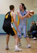 12 December 2004; Kevin Foley, UCD Marian, in action against Andrew Dolliver, Queens. Senior Men's National Cup, Round 2, UCD Marian v Queens, St Vincent's CBS, Glasnevin, Dublin. Picture credit; Brian Lawless / SPORTSFILE