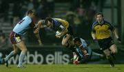 10 December 2004; Girvan Dempsey, Leinster, is tackled by Jean Francois Coux and Anthony Forest (14), Bourgoin. Heineken European Cup 2004-2005, Pool 2, Round 4, Bourgoin v Leinster, Bourgoin-Jailleau, France. Picture credit; Brendan Moran / SPORTSFILE