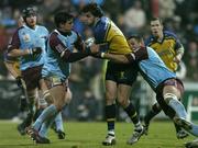 10 December 2004; Shane Horgan, Leinster, is tackled by David Janin, left, and Julien Frier, Bourgoin. Heineken European Cup 2004-2005, Pool 2, Round 4, Bourgoin v Leinster, Bourgoin-Jailleau, France. Picture credit; Brendan Moran / SPORTSFILE