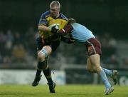 10 December 2004; Victor Costello, Leinster, is tackled by Jean Francois Coux, Bourgoin. Heineken European Cup 2004-2005, Pool 2, Round 4, Bourgoin v Leinster, Bourgoin-Jailleau, France. Picture credit; Brendan Moran / SPORTSFILE