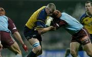 10 December 2004; Victor Costello, Leinster, is tackled by Julien Bonnaire, Bourgoin. Heineken European Cup 2004-2005, Pool 2, Round 4, Bourgoin v Leinster, Bourgoin-Jailleau, France. Picture credit; Brendan Moran / SPORTSFILE