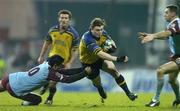 10 December 2004; Brian O'Driscoll, Leinster, gets past the tackle of David Janin, left, and Jean Francois Coux, Bourgoin, on his way to scoring a late try to win the game. Heineken European Cup 2004-2005, Pool 2, Round 4, Bourgoin v Leinster, Bourgoin-Jailleau, France. Picture credit; Brendan Moran / SPORTSFILE
