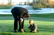 15 December 2004; Padraig Harrington places the ball for his 16 month old son Paddy at a photocall to launch the Padraig Harrington Charitable Foundation and to provide details of the staging of The Padraig Harrington Charity Golf Show. Citywest Hotel, Dublin. Picture credit; Pat Murphy / SPORTSFILE