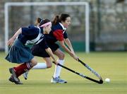 17 December 2004; Jane Latham, right, Wesley College, is tackled by Juliett Gilligan, Mount Anville. Schoolgirls Leinster Premier League, Mount Anville v Wesley College, Grange Road, Dublin. Picture credit; Matt Browne / SPORTSFILE