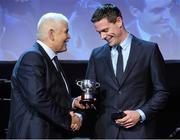 10 November 2013; Dublin captain Stephen Cluxton is presented with a replica of the Sam Maguire Cup by Dublin County Board Chairman Andy Kettle during the Dublin senior football medal presentation banquet. National Convention Centre, Spencer Dock, North Wall Quay, Dublin. Picture credit: Ray McManus / SPORTSFILE