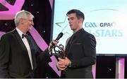 8 November 2013; Dublin's Michael Darragh Macauley is interviewed by MC Michael Lyster after receiving the 2013 GAA GPA Footballer of the Year award, sponsored by Opel. GAA GPA All-Star Awards 2013 Sponsored by Opel, Croke Park, Dublin Picture credit: Brendan Moran / SPORTSFILE