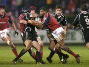 18 December 2004; Ryan Jones, The Ospreys, is tackled by Alan Quinlan and Jim Williams, Munster. Celtic League 2004-2005, Munster v Neath Swansea Ospreys, Musgrave Park, Cork. Picture credit; Brendan Moran / SPORTSFILE