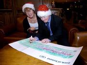 23 December 2004; Mary Davis, Director, Special Olympics Ireland and Special Olympics Athlete Brian Keogh, from Raheny, Dublin, at the presentation of a cheque for Û35,000 being the proceeds from the sale of 'Midsummer Magic', a collection of images from the 2003 World Special Olympics Games as photographed by the press photographers of Ireland. Picture credit; Ray McManus / SPORTSFILE