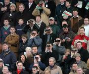 27 December 2004; Race fans keep a close eye on the paddypower.com Future Champions Novice Hurdle. Leopardstown Racecourse, Dublin. Picture credit; Pat Murphy / SPORTSFILE