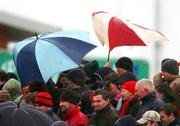 27 December 2004; Supporters brave the elements during the game. Celtic League 2004-2005, Pool 1, Connacht v Munster, Sportsground, Galway. Picture credit; David Maher / SPORTSFILE