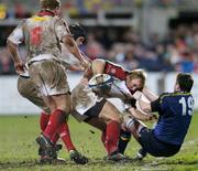 27 December 2004; Roger Wilson, supported by team-mates Campbell Feather (6) and Matt McCullough, Ulster, is tackled by Eric Miller, Leinster. Celtic League 2004-2005, Pool 1, Leinster v Ulster, Donnybrook, Dublin. Picture credit; Brian Lawless / SPORTSFILE