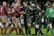 18 December 2004; Players from both Munster and The Ospreys get involved in a tussle as referee Iain Ramage prepares to intervene. Celtic League 2004-2005, Munster v Neath Swansea Ospreys, Musgrave Park, Cork. Picture credit; Brendan Moran / SPORTSFILE